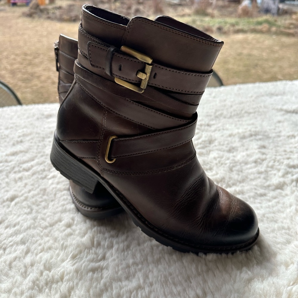 In Great condition. Clarks, brown leather boots. With straps and buckles.